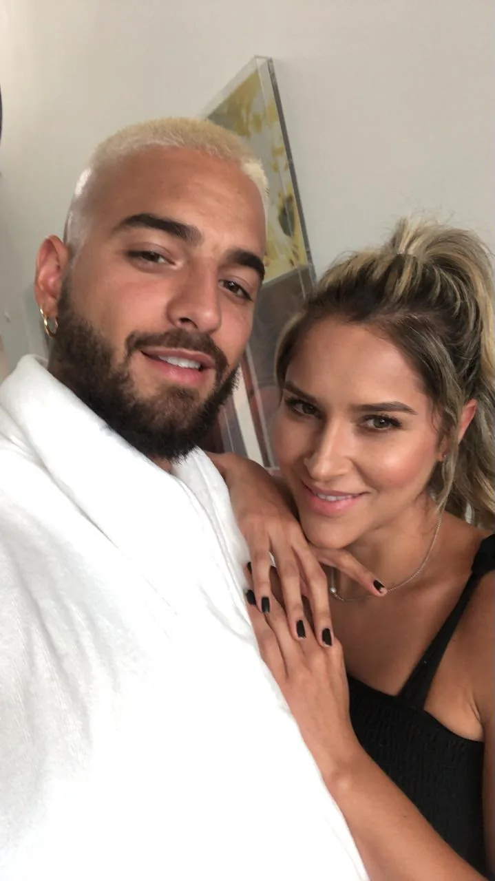 Selfie of Moni Aristi with an artist in a robe, behind the scenes