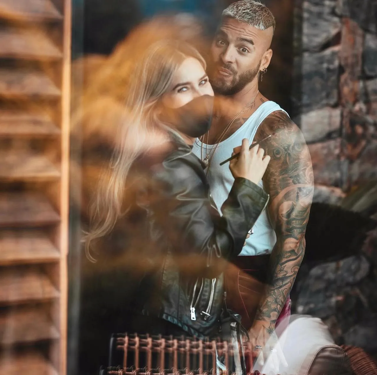 Artistic double-exposure portrait of Maluma during a makeup backstage session